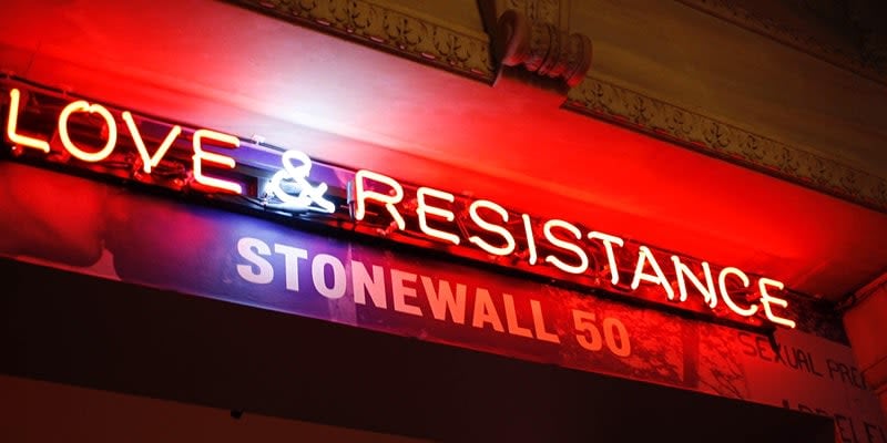 A photo of a sign saying love & resistance Stonewall 50